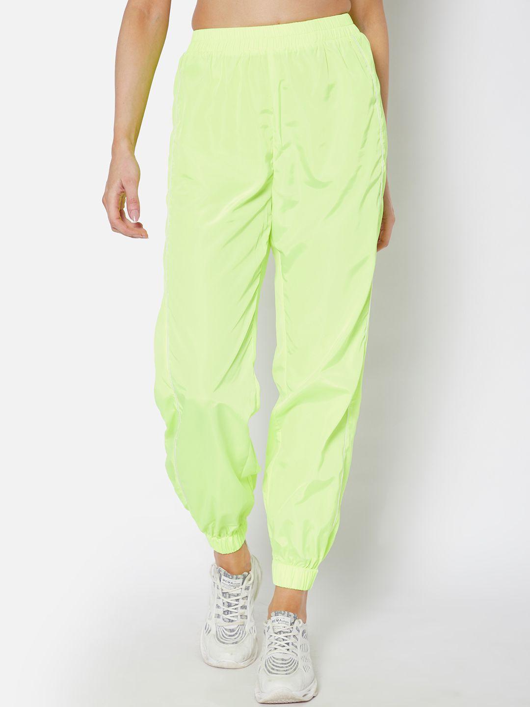 urbanic women fluorescent green solid tapered fit joggers