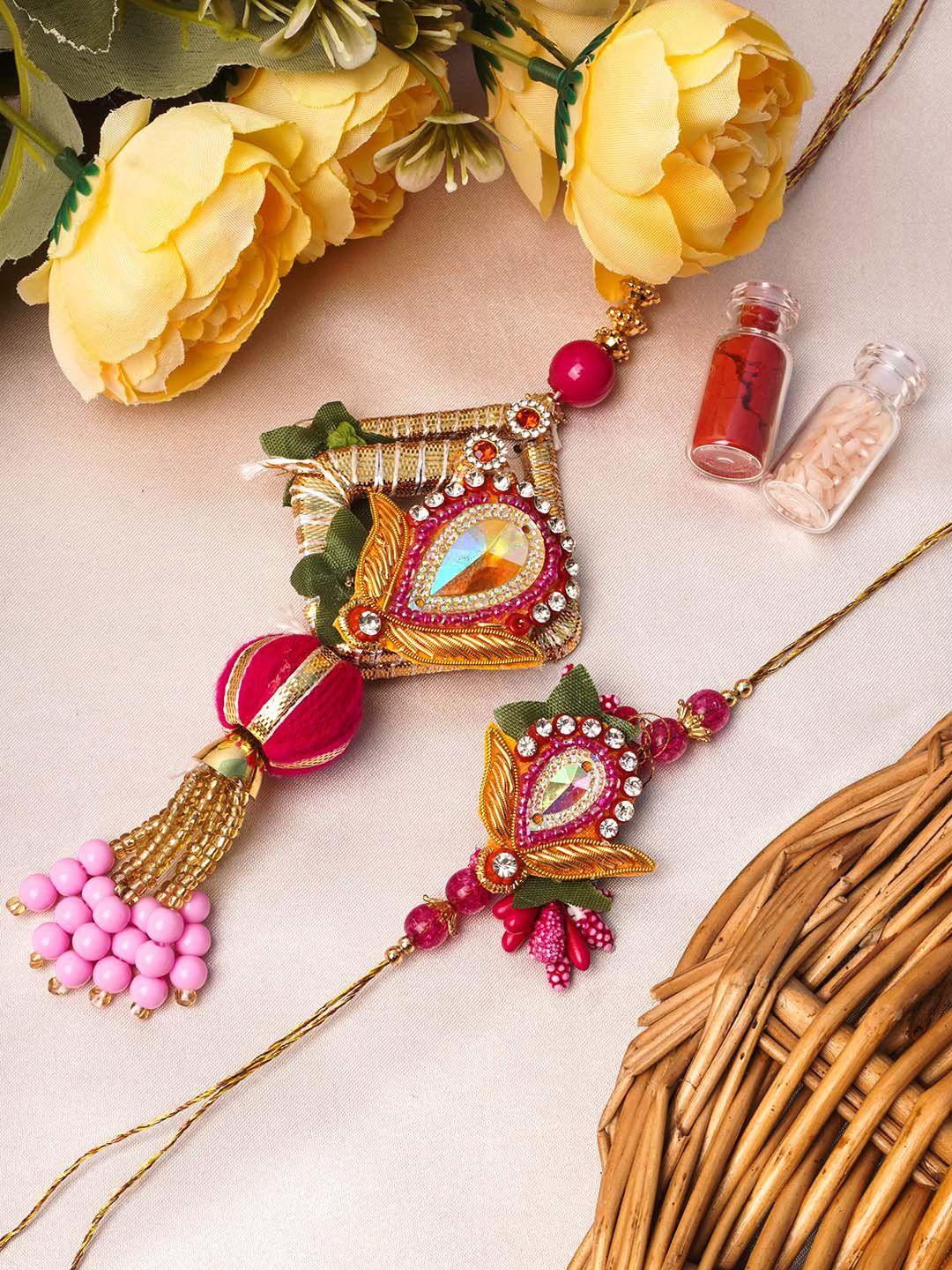 urmika set of 2 gold-toned white & pink stone-studded & beaded rakhi with roli chawal