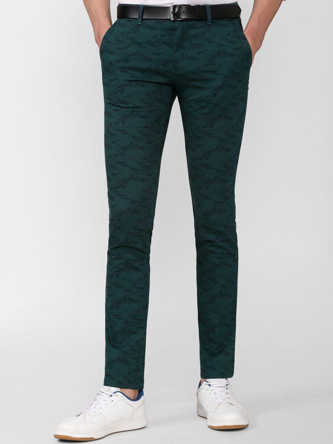 v dot men green printed slim fit trousers