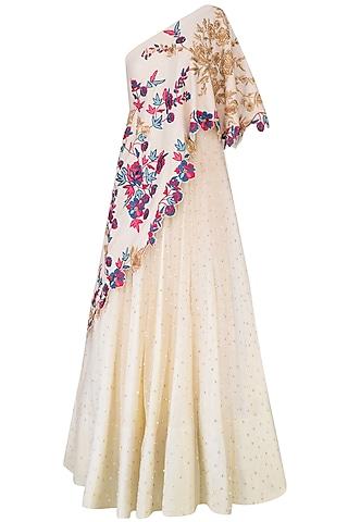 vanilla color one shoulder gown with embroidered aymmetric cape