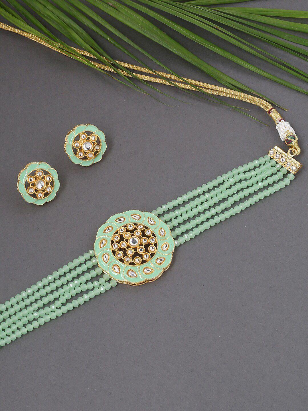 viraasi gold-toned & green kundan-studded & beaded jewellery set