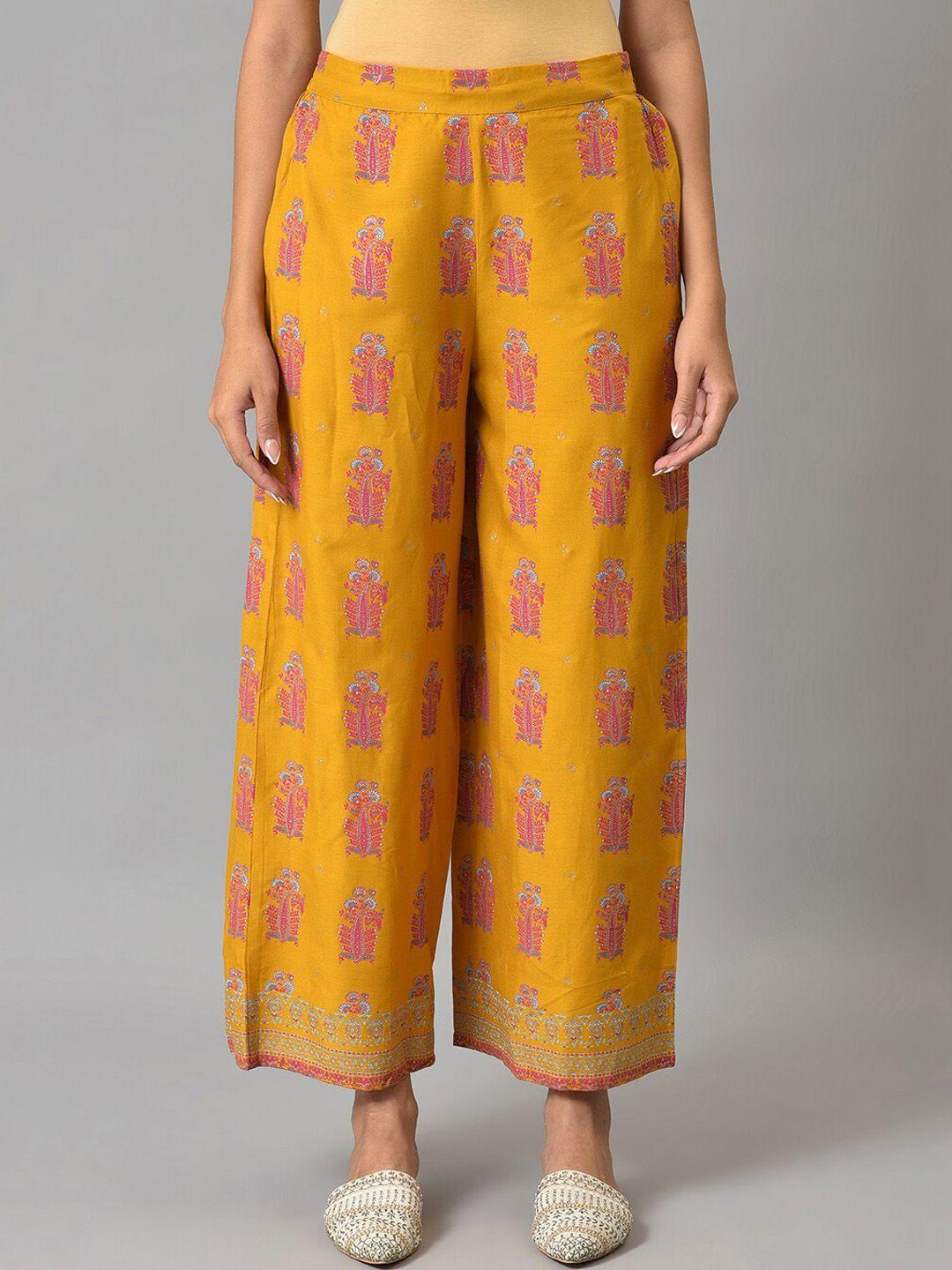 w women mustard yellow ethnic motifs printed parallel trousers