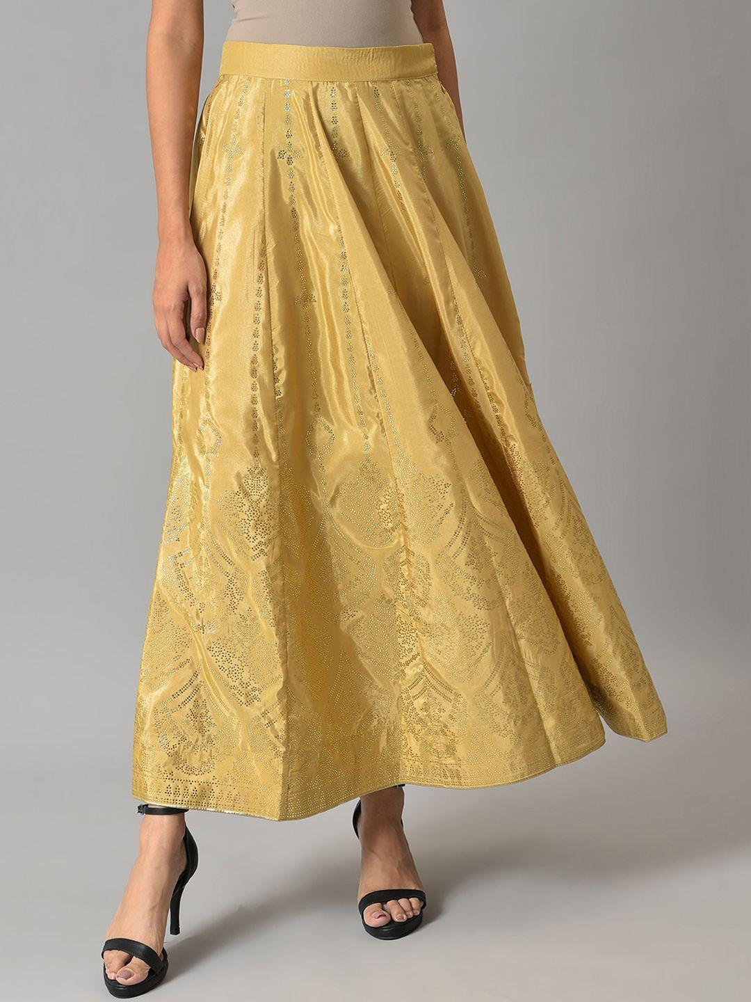 w women gold-colored printed flared maxi skirts