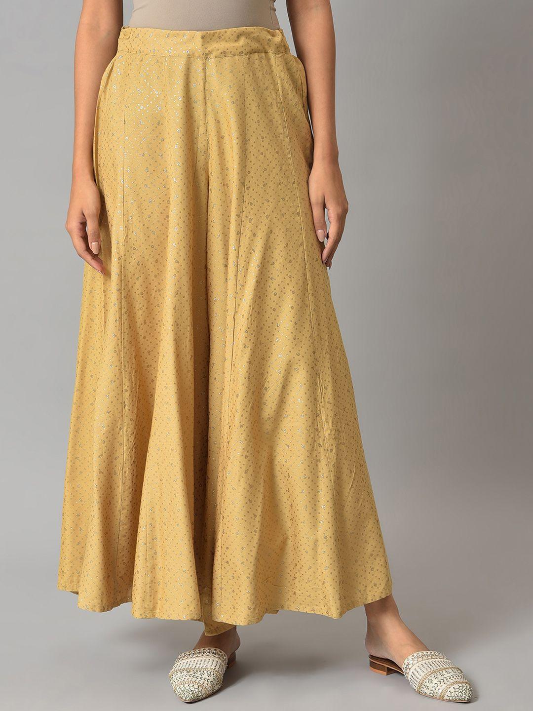 w women golden colored glitter printed flared maxi skirts