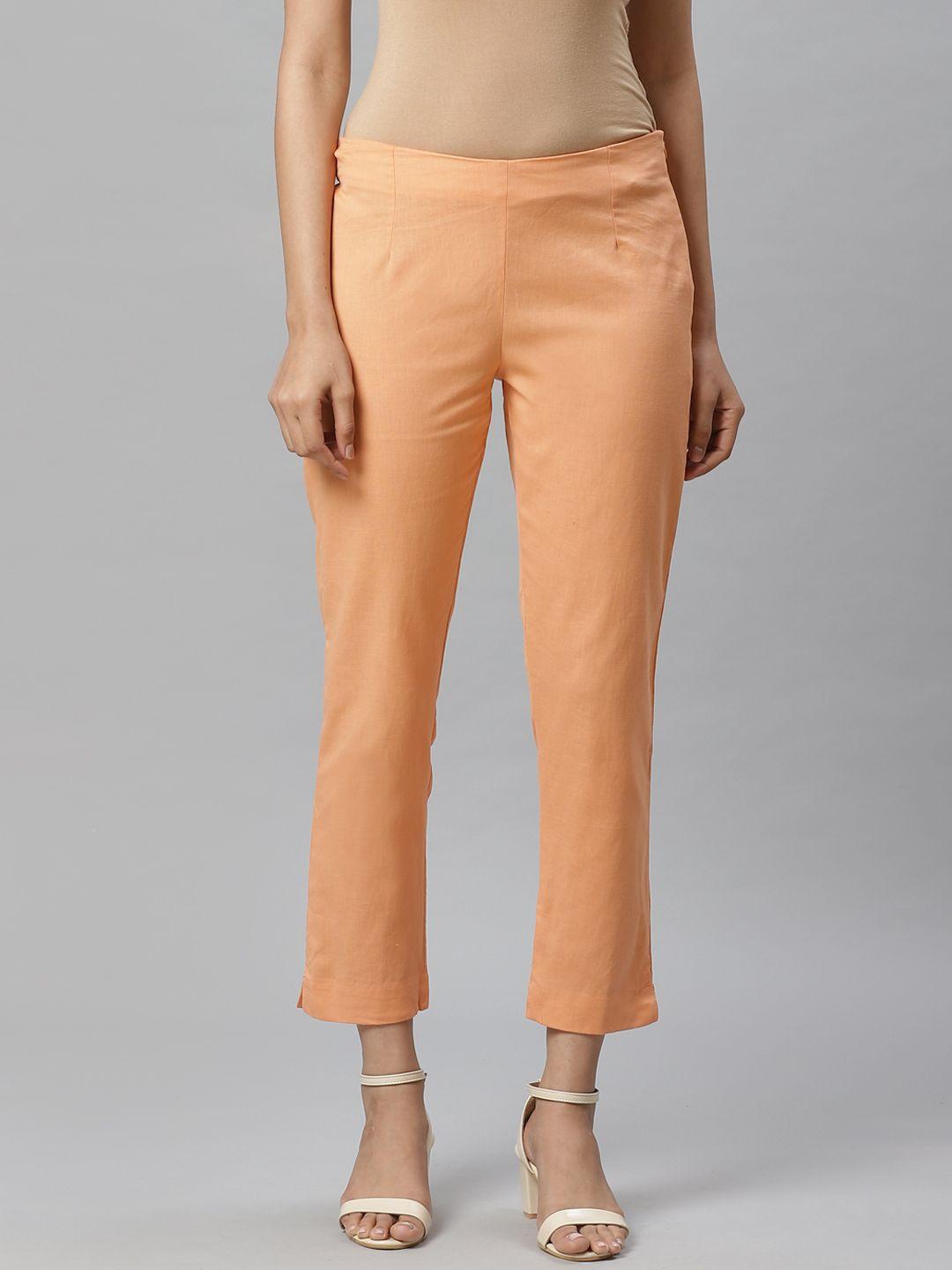 w women peach-coloured slim fit solid regular cropped trousers