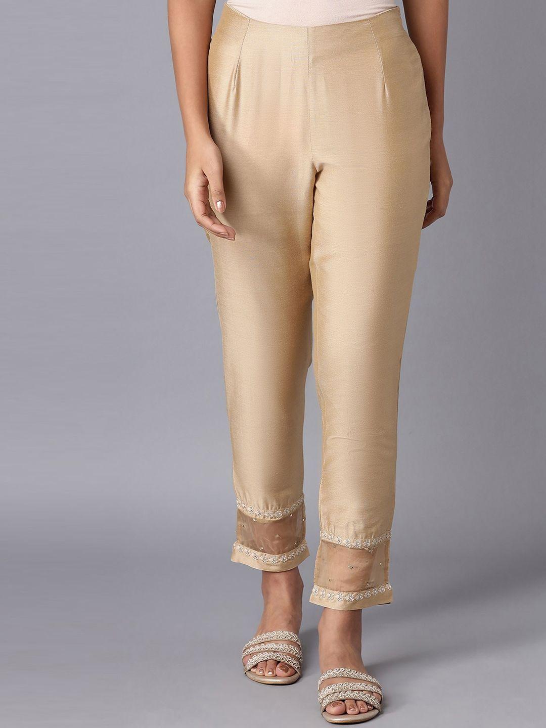 w women solid gold toned trousers