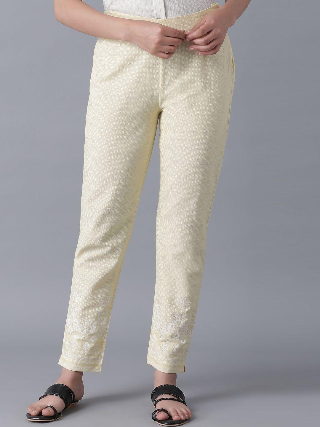 w women yellow slim fit solid regular trousers