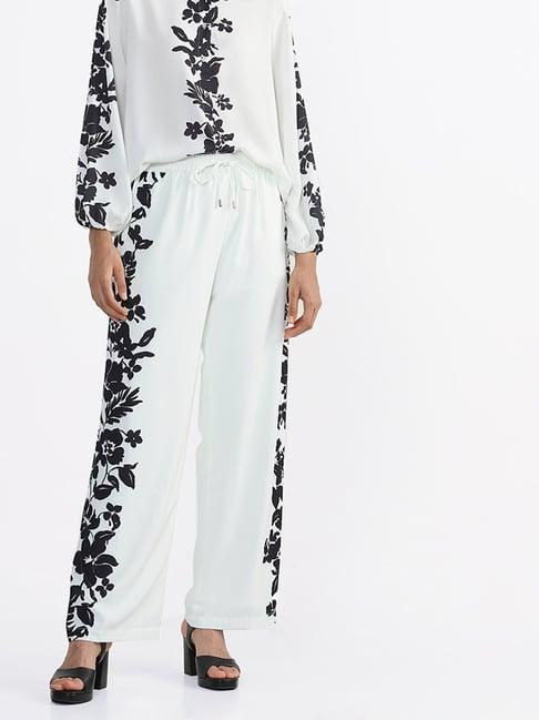 wardrobe by westside black floral printed white trousers