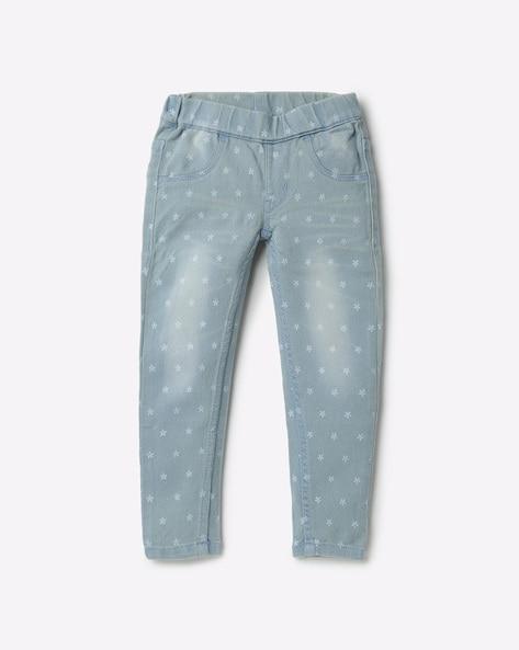 washed jeggings with star motifs