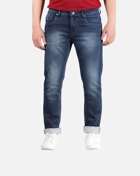 washed jeans with mid rise waist