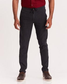 washed tapered fit flat-front pants