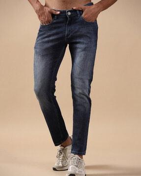washed tapered jeans