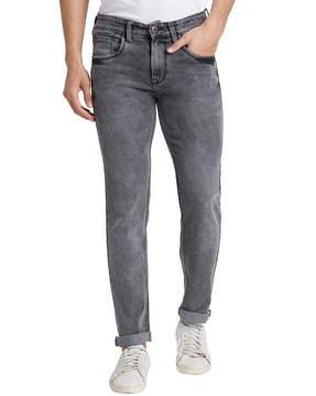 washed tapered jeans