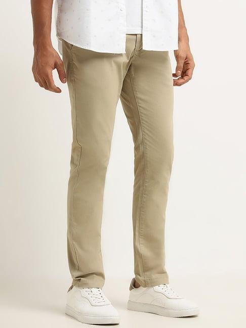 wes casuals by westside dark beige slim fit mid rise trousers