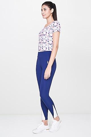 white printed top with blue leggings