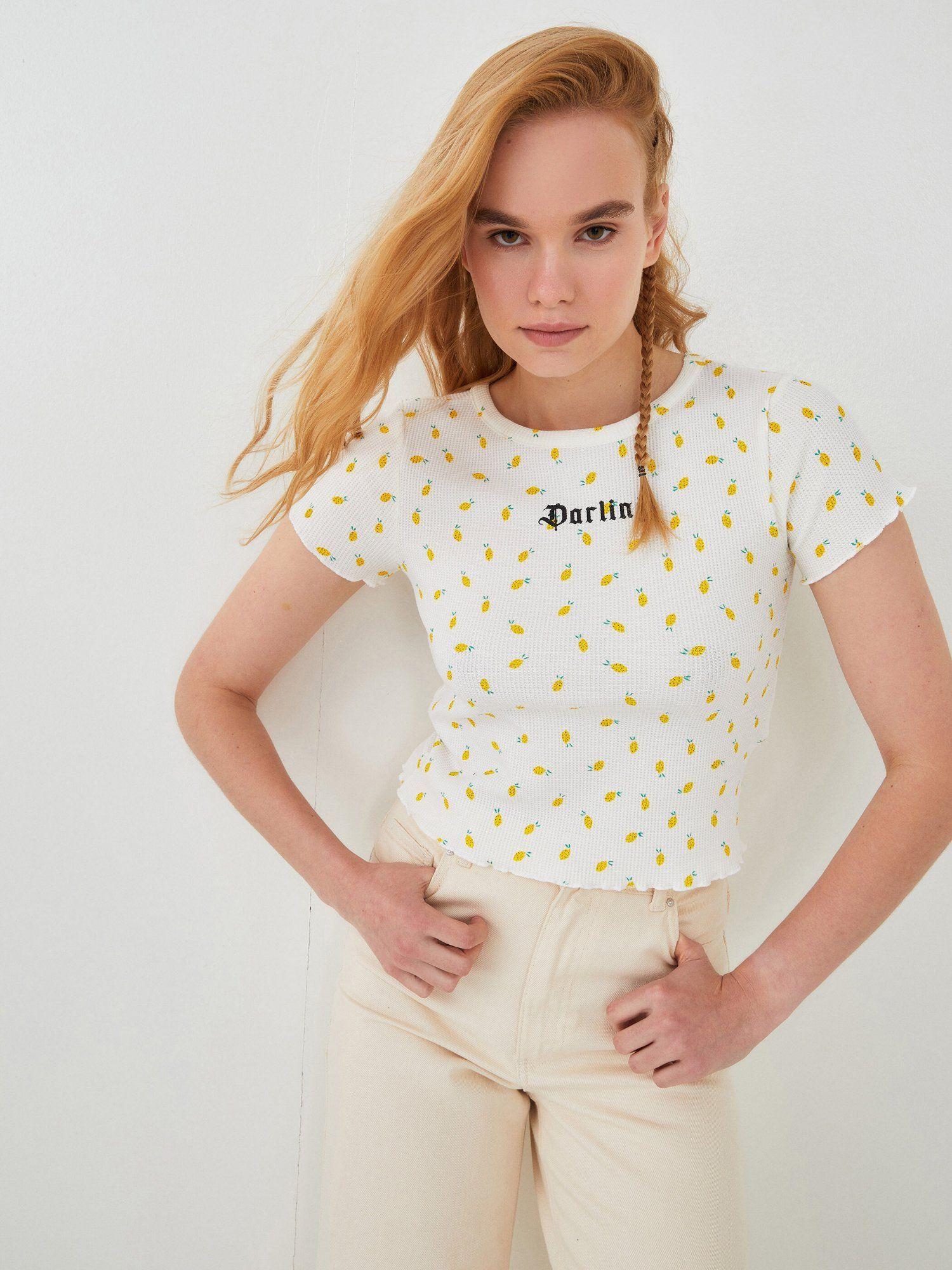 white and yellow all over printed t-shirt