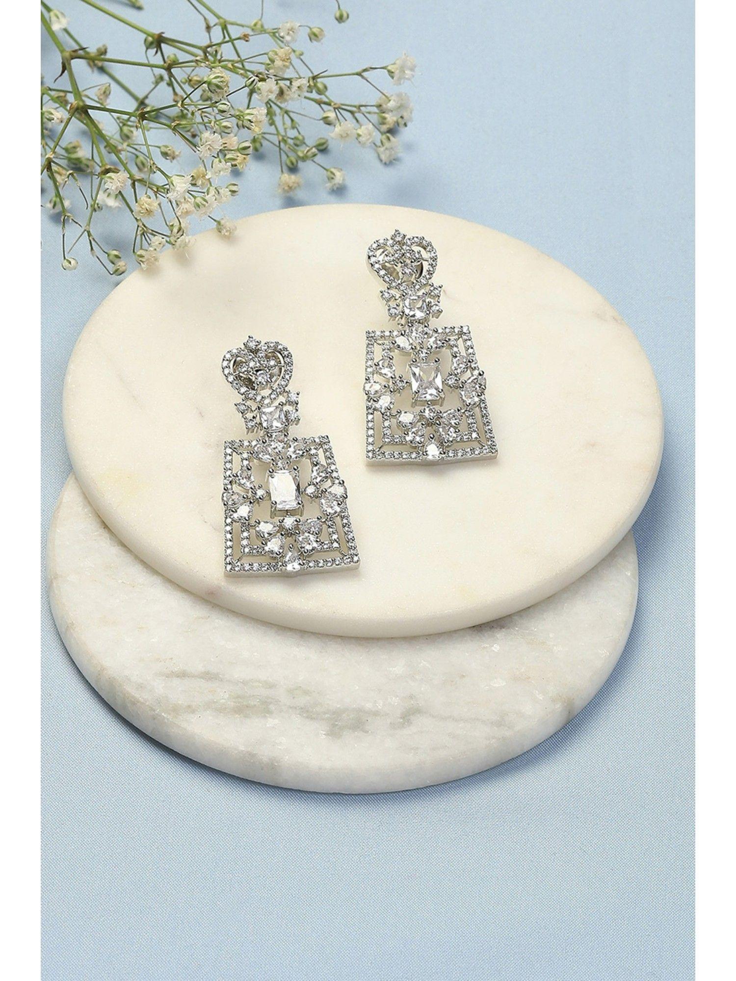 white brass earrings