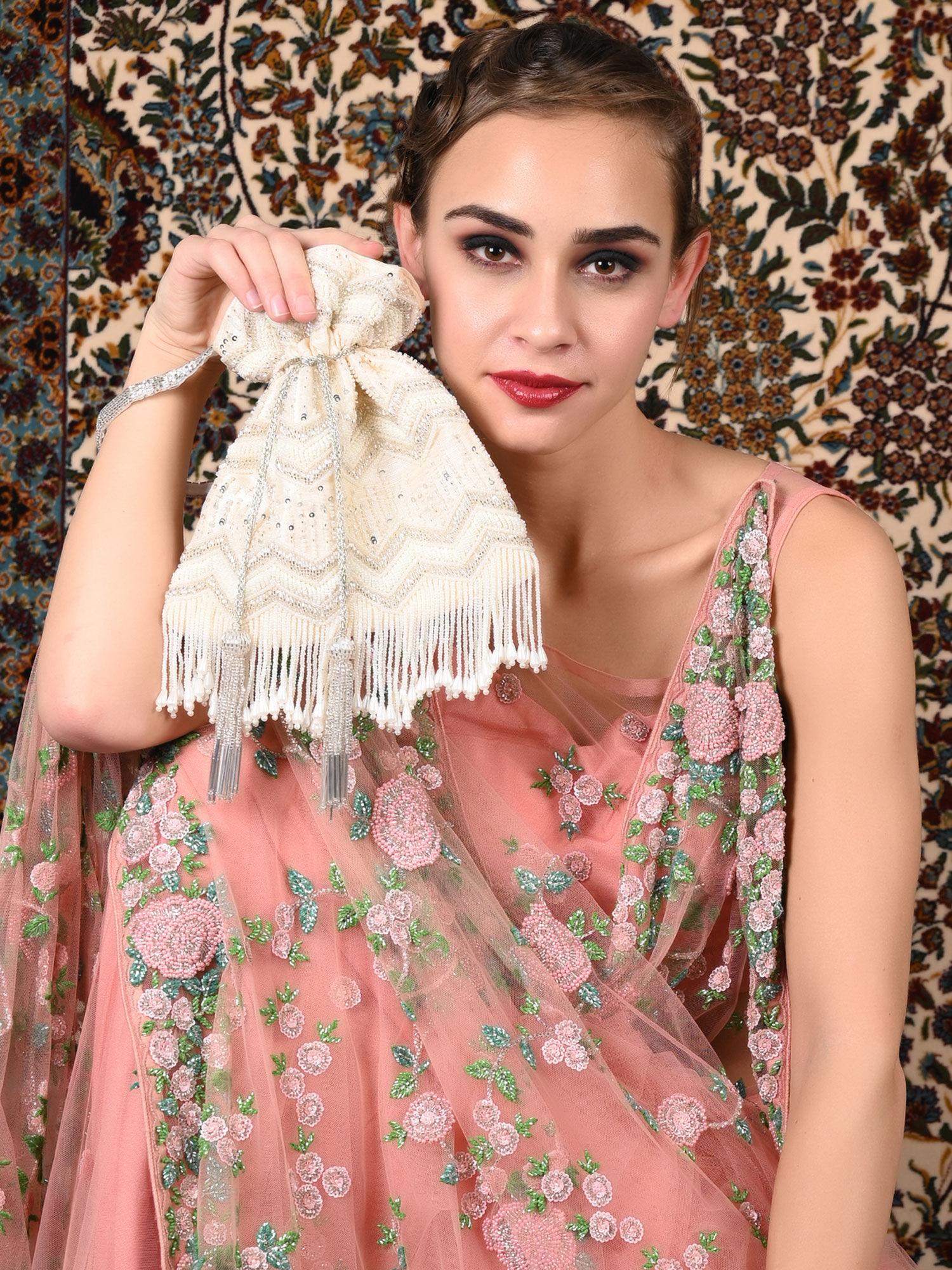 white embellished tassel potli