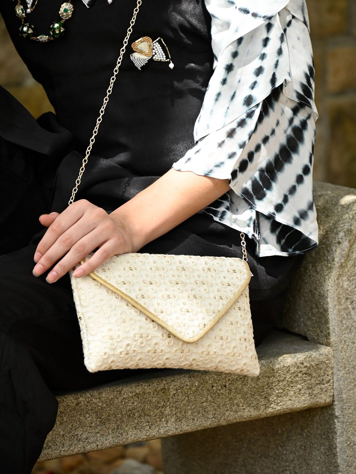 white embroidered clutch bag