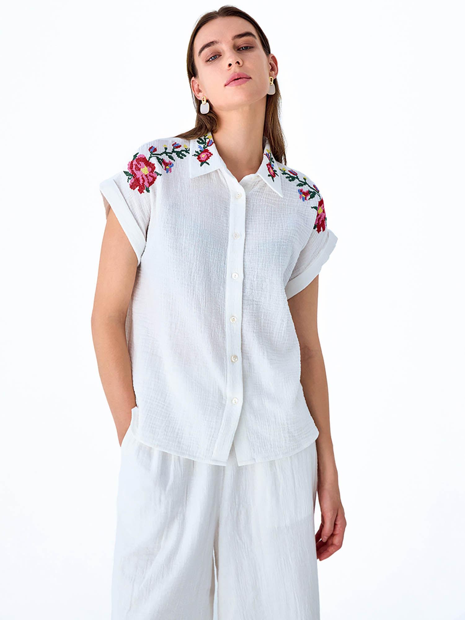 white embroidered cross stitch shirt