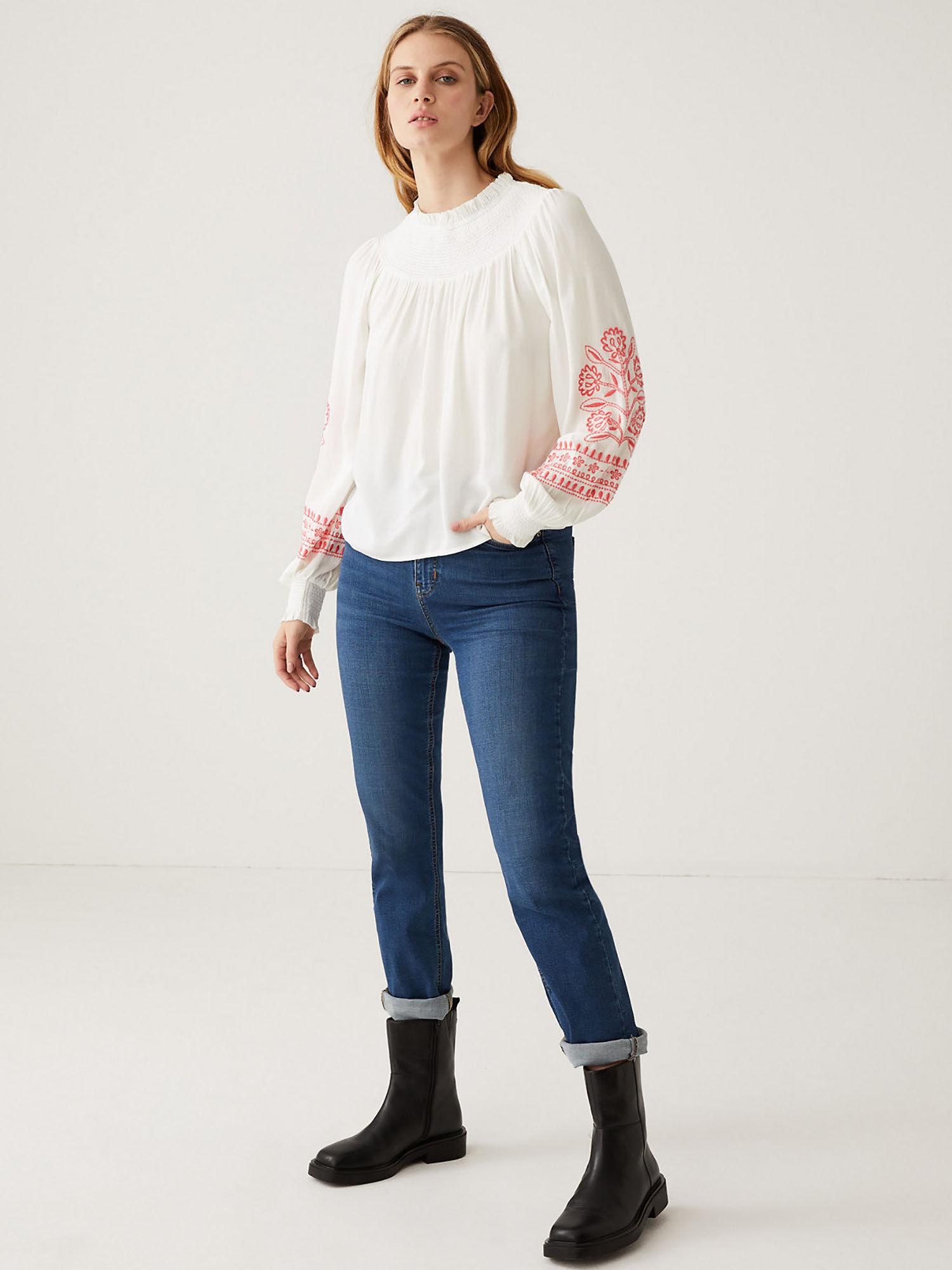 white embroidered funnel neck blouse