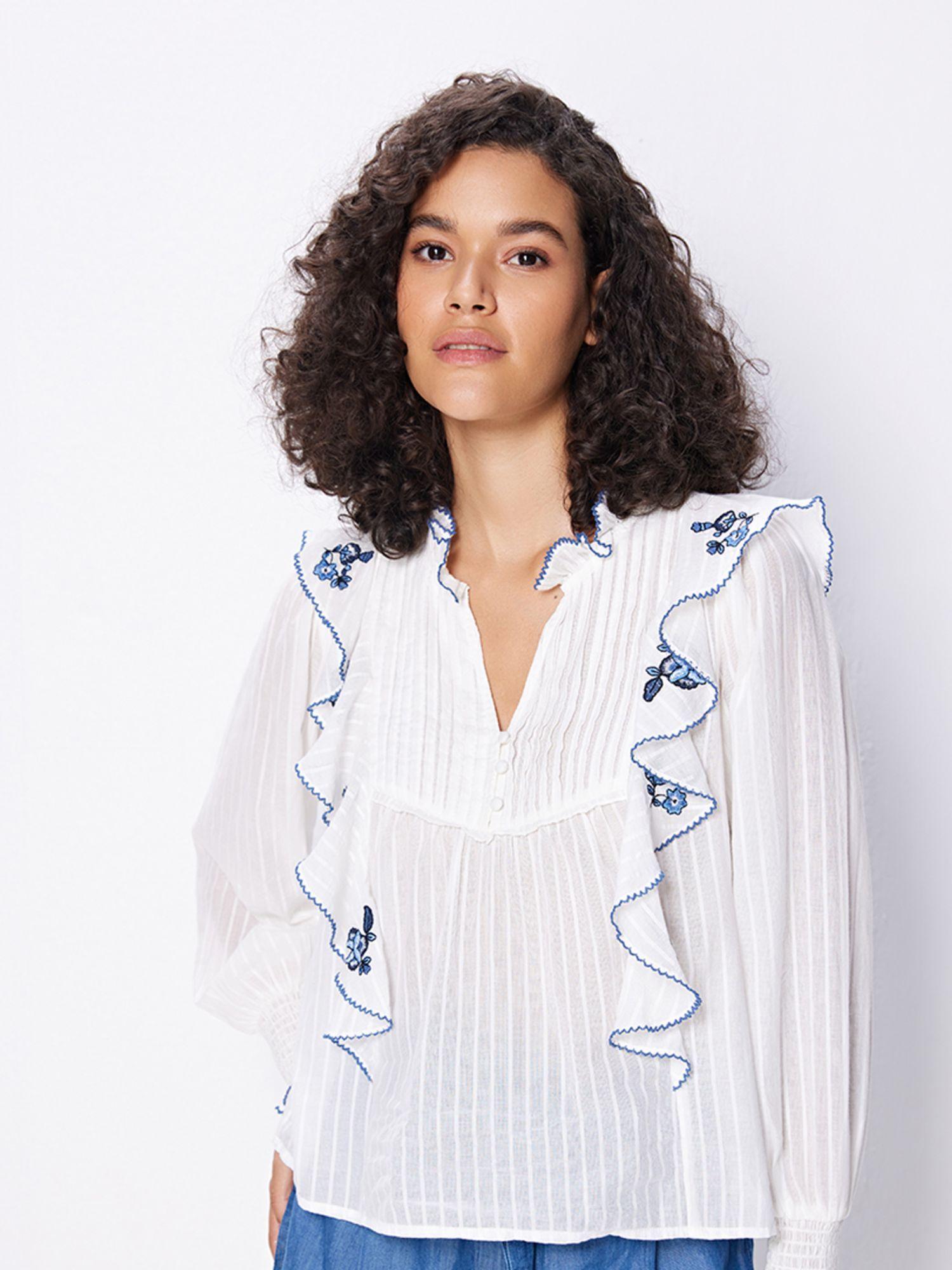 white embroidered ruffle top