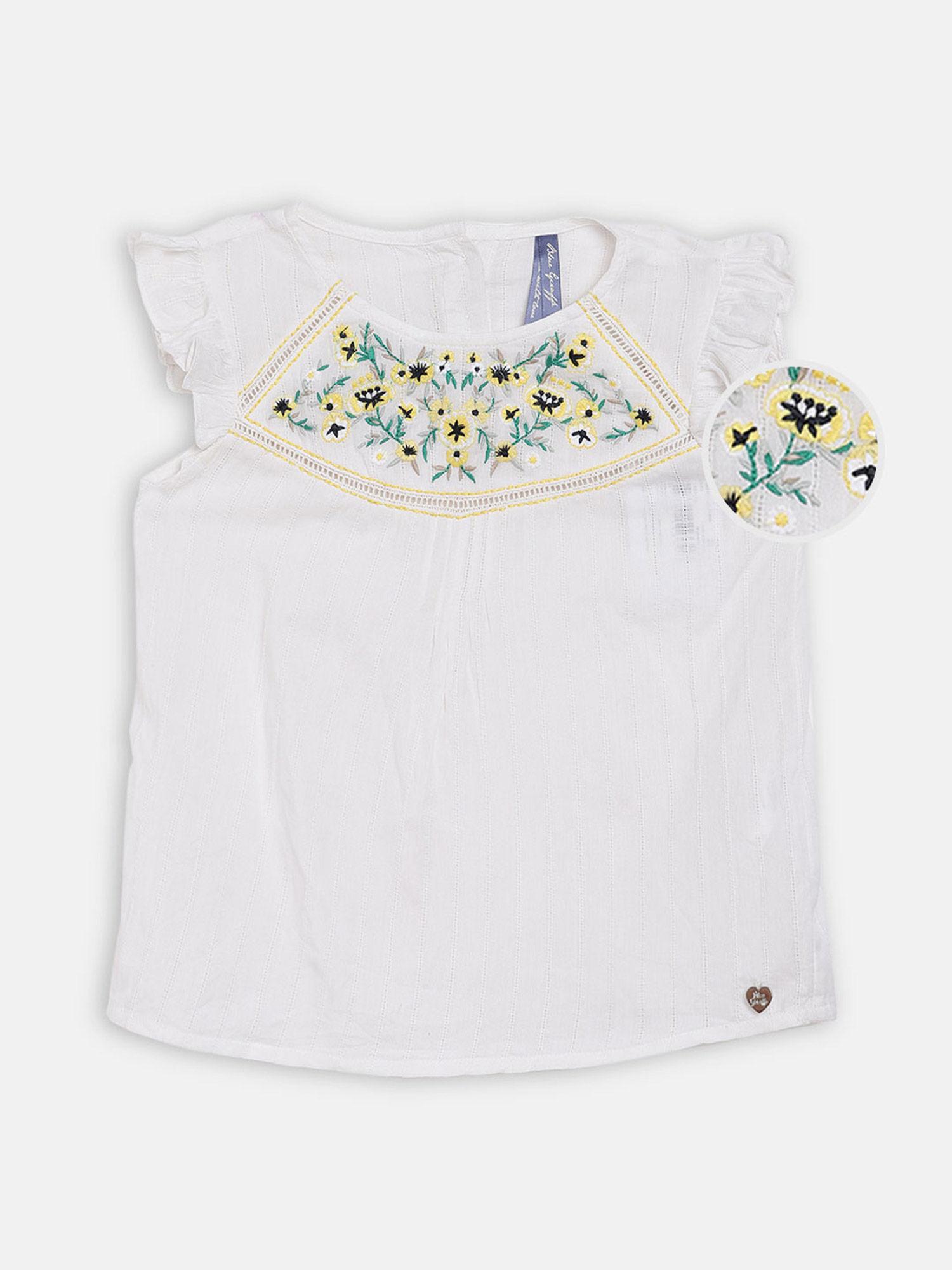 white embroidered top