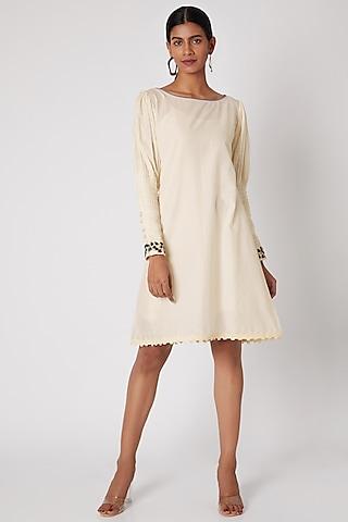 white embroidered tunic with pleated sleeves