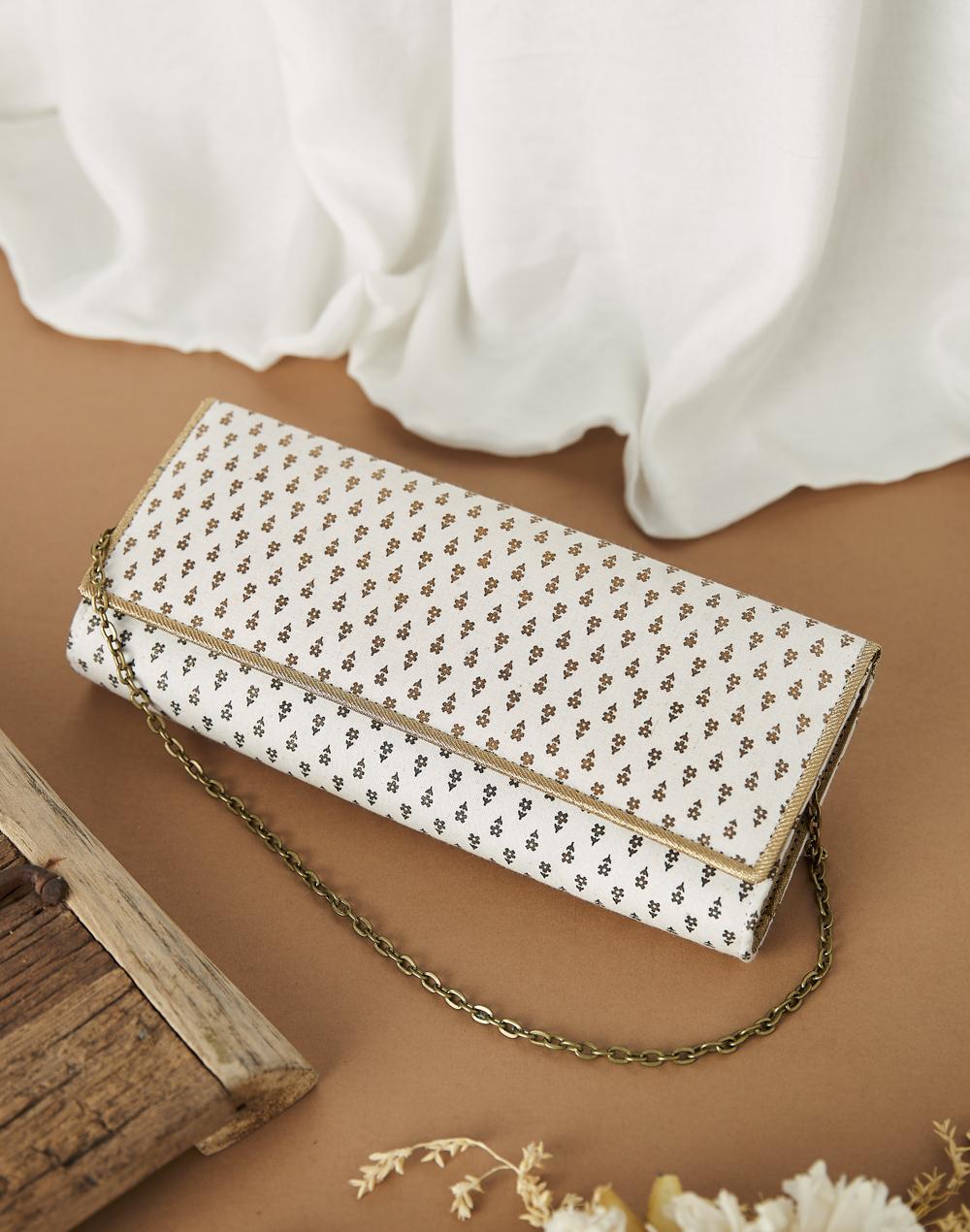 white fabric floral printed clutch