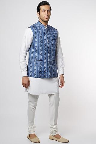 white katan kurta set with blue embroidered bundi jacket