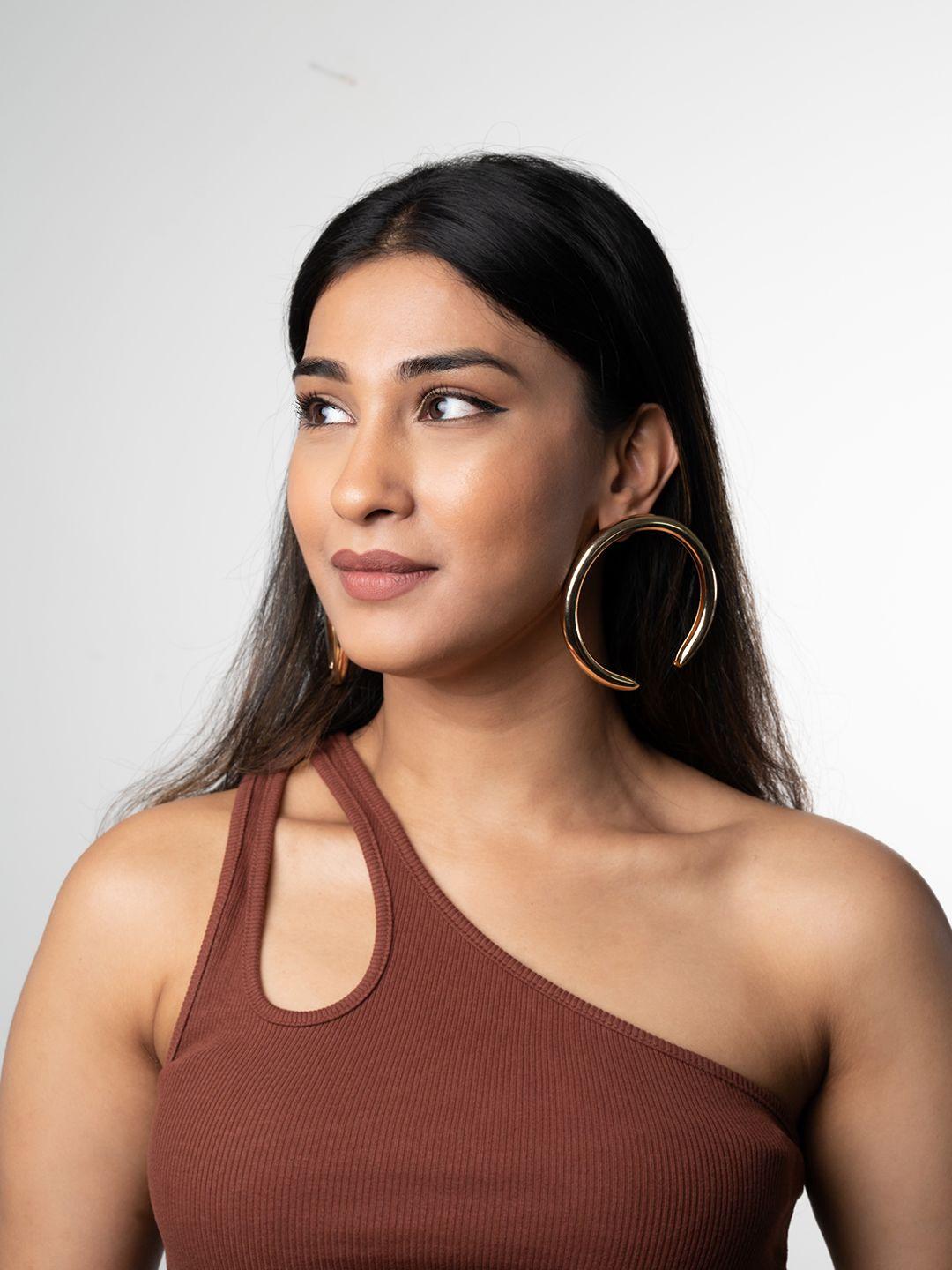 white lies gold-toned contemporary half hoop earrings