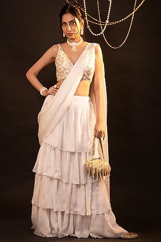 white satin ruffled skirt saree set