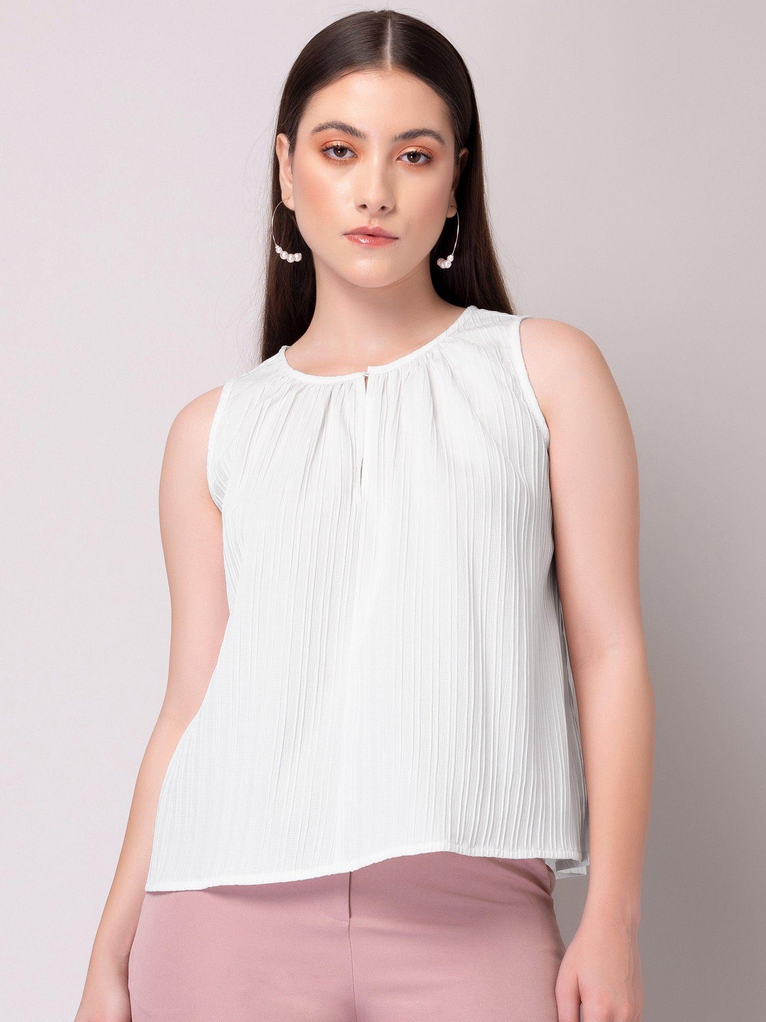 white textured sleeveless top