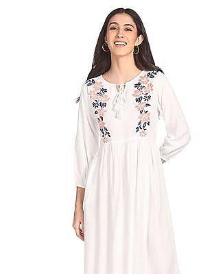 white three-quarter sleeve flared embroidered dress