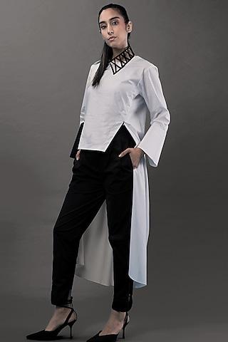 white tunic with leather detailing