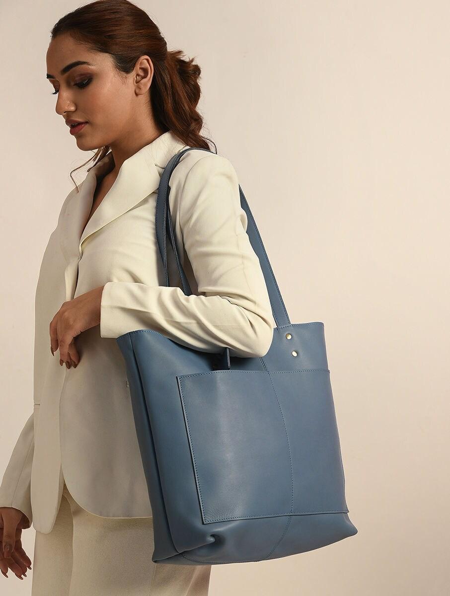women blue leather tote bag