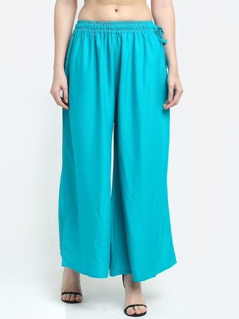 women firozi excess flared rayon palazzo with fully elasticated waistband, slip on closure, drawstrings at the side along with 2 pockets on the side.