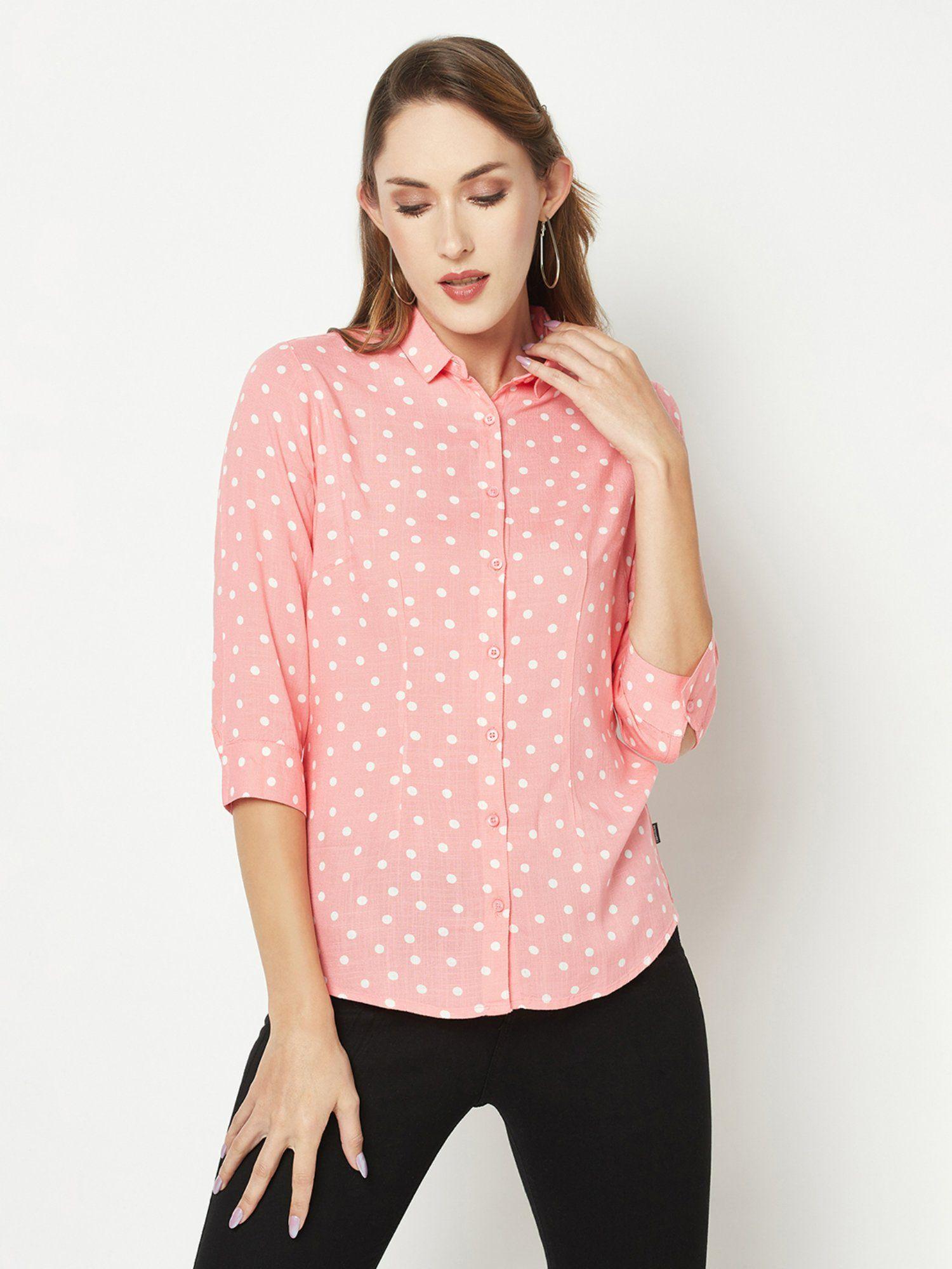 women pink polka-dotted shirt