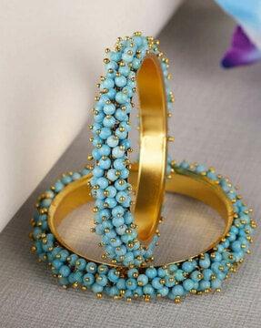 women set of 2 gold-plated beaded bangles