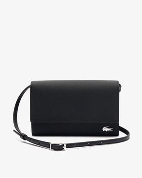 women sling bag with snap-button closure