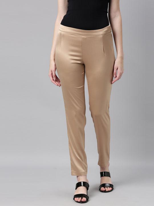 women solid gold mid rise shiny pants