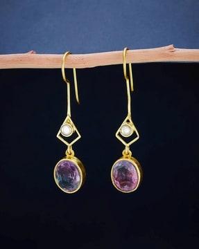 women stone-studded dangler earrings