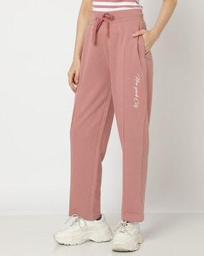 women straight track pants with typographic print