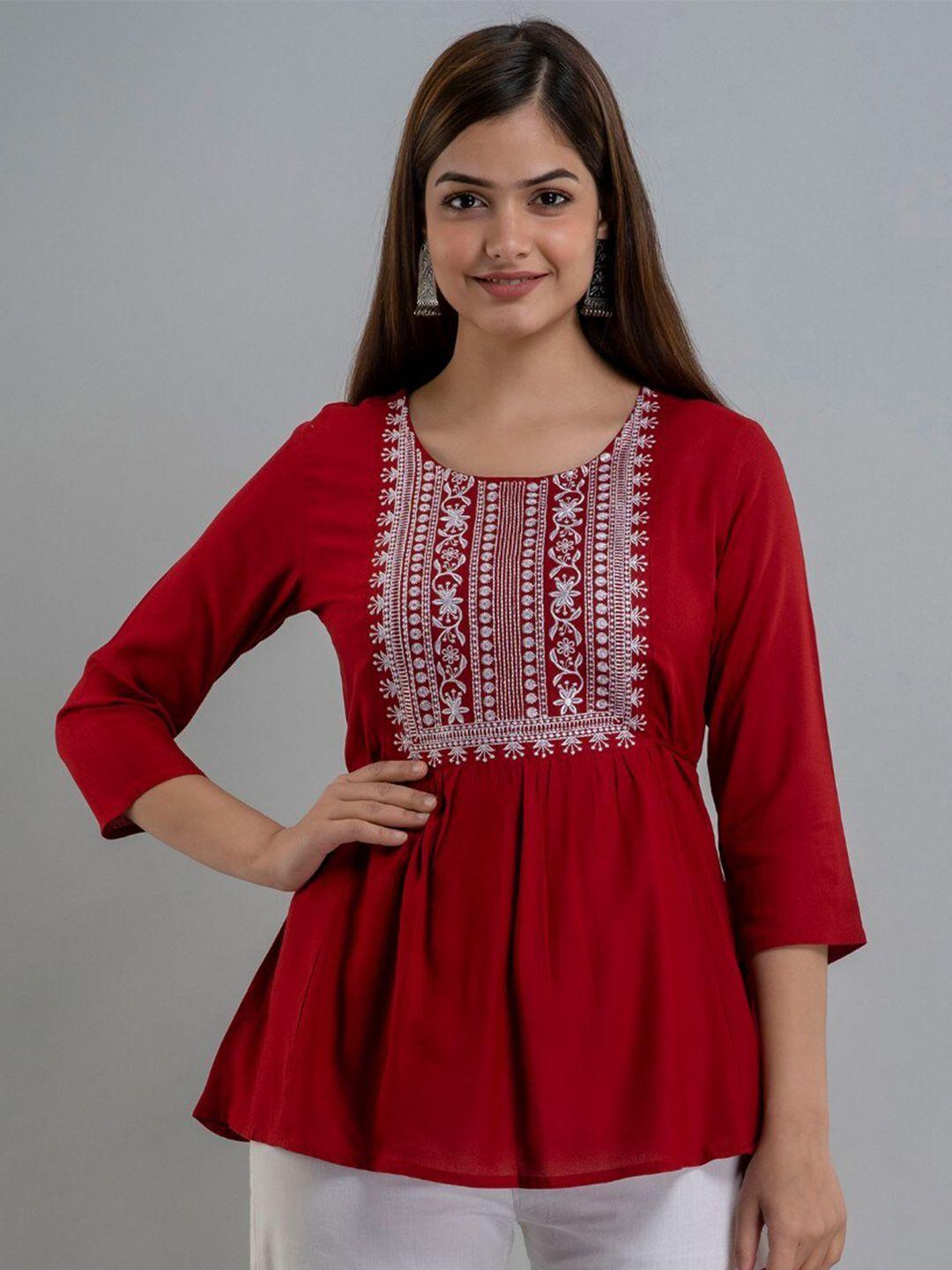 women touch ethnic motifs embroidered top