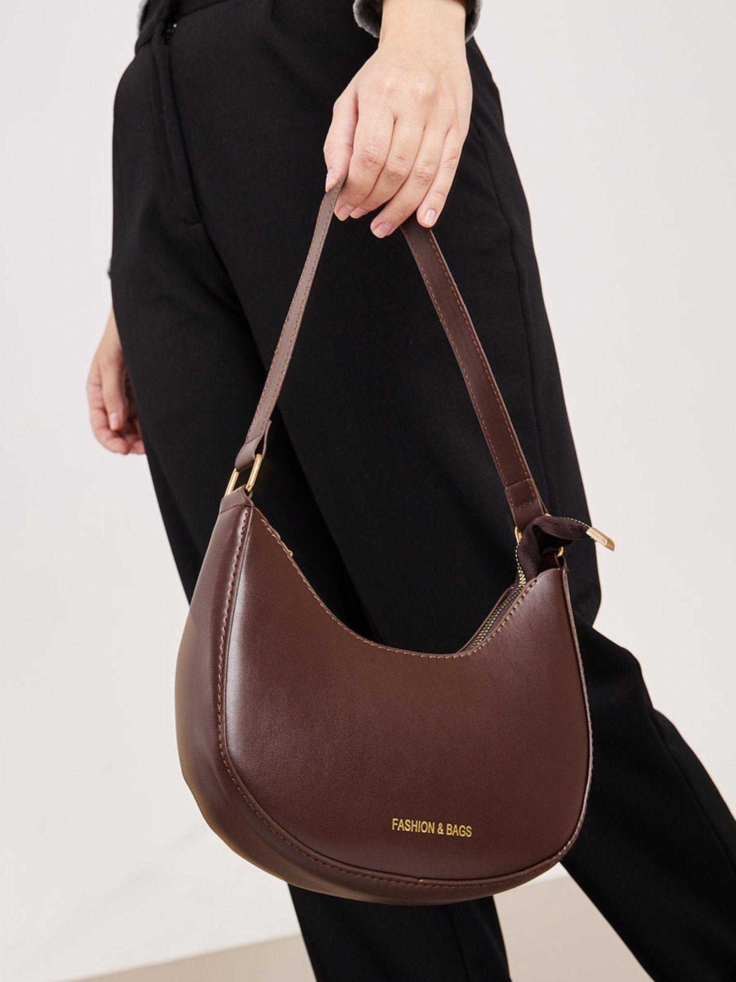 women's brown half moon shape bag with zip closure