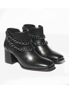 women ankle-length boots with metal accent