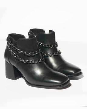 women ankle-length boots with metal accent