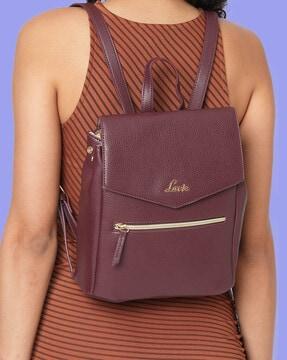 women backpack with snap-button closure