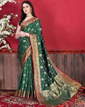 women banarasi saree with contrast border & tassels