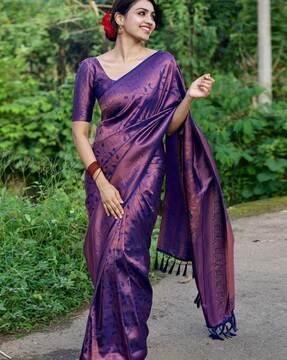 women banarasi woven saree with tasselled border